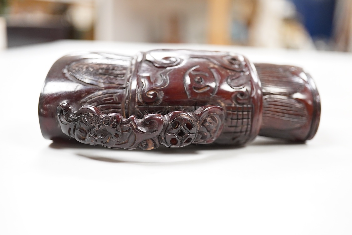 A Chinese carved horn jug, 11cm high
